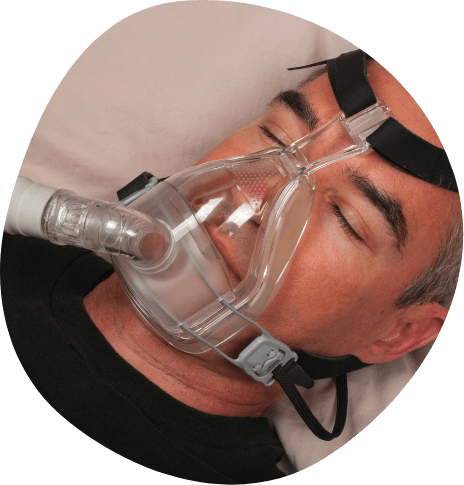 Sleeping man wearing C P A P mask