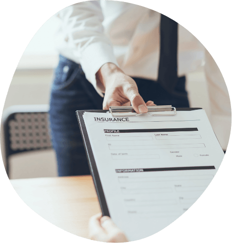 Person holding clipboard with insurance form