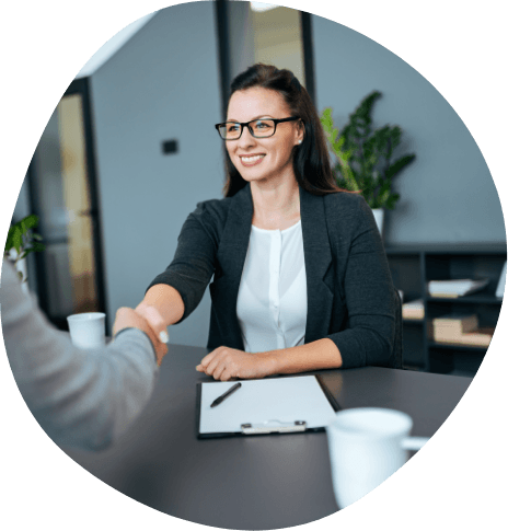 Woman shaking hands with sleep center team member