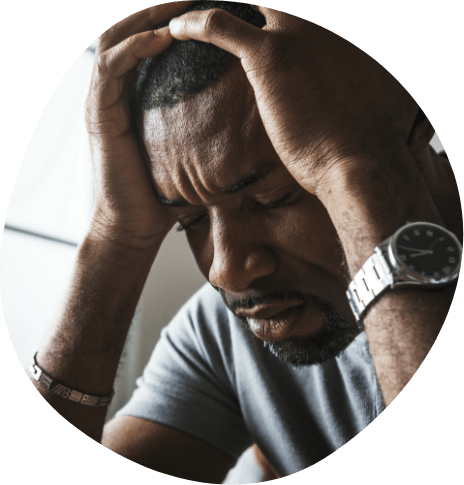 Man touching his temples in frustration