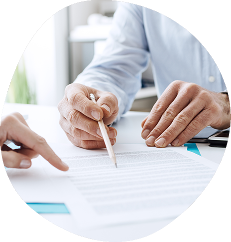 Person pointing to part of a paper with a pencil