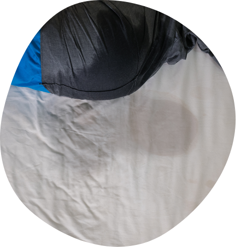 Wet spot on white bedsheets