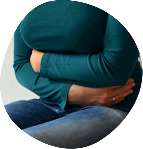 Person hugging their torso