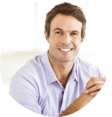 Smiling man in light blue button up shirt