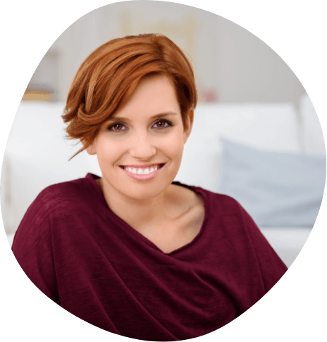Smiling woman in dark red blouse