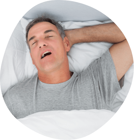 Man sleeping on back with one hand behind head