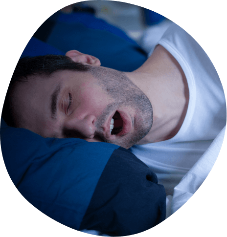 Man sleeping on his side with his mouth open