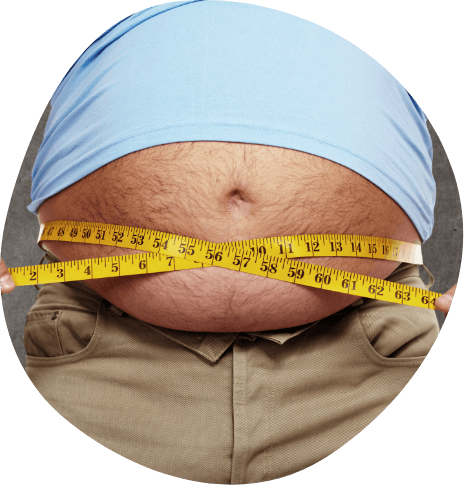 Person wrapping a tape measure around their stomach