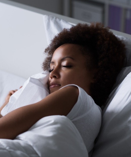 Woman sleeping soundly after sleep disorder treatment in McKinney