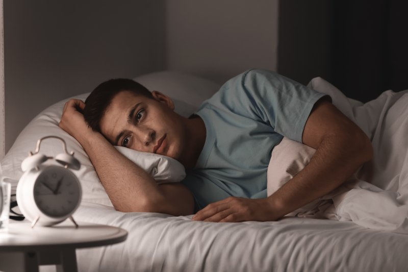 young man struggling with insomnia